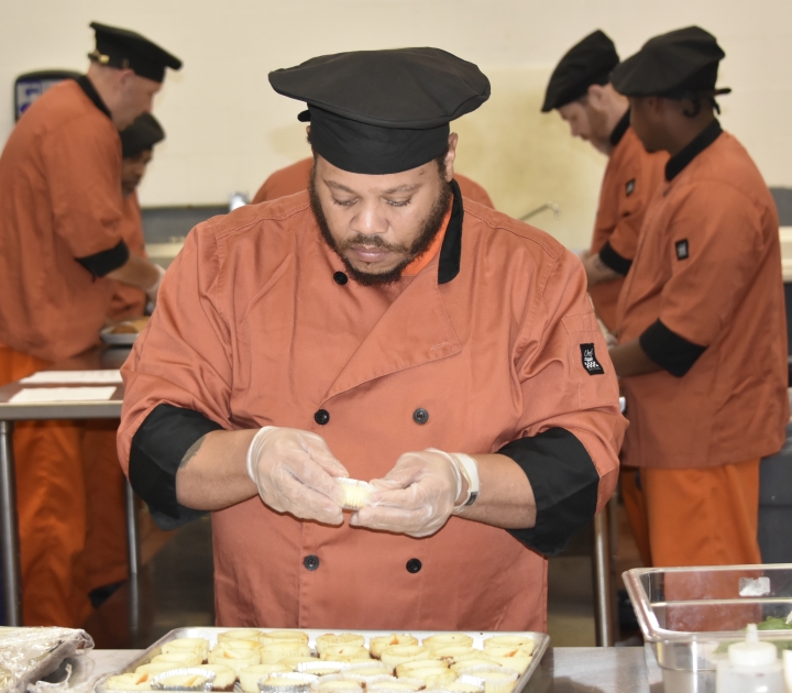 A THRIVE participant preparing a dish