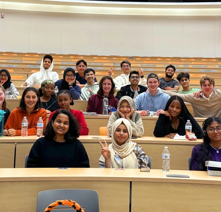 Group of students in class smiling