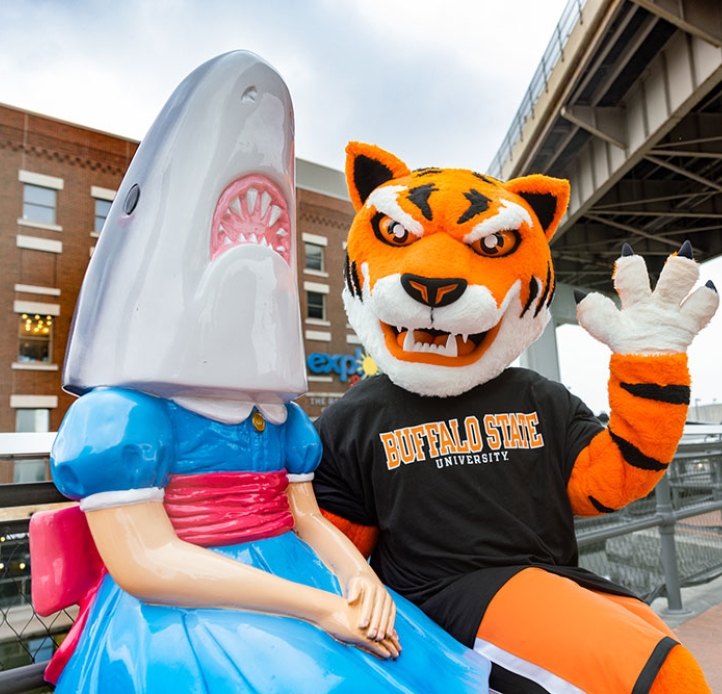 Benji sitting next to Shark Girl