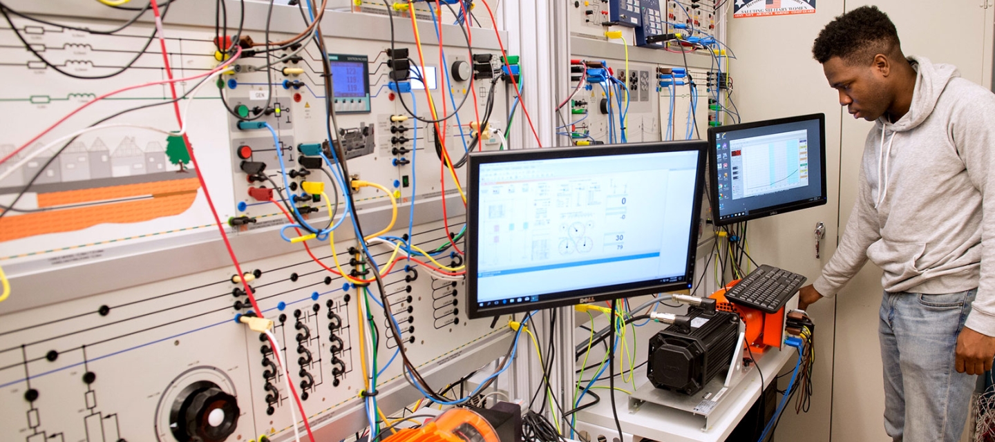 student using computer in smart grid lab 