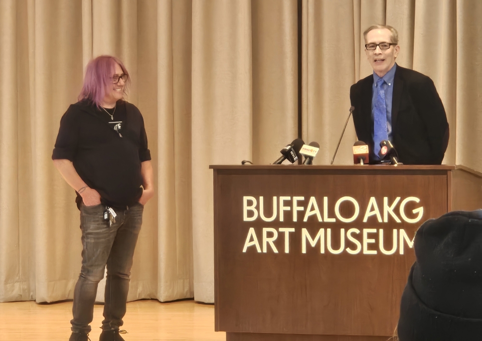 Robby Takac and Anthony Chase speaking to a crowd