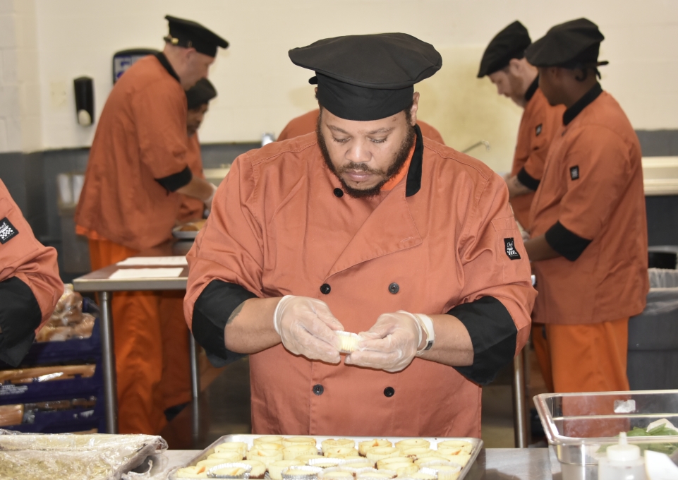 A THRIVE participant preparing a dish