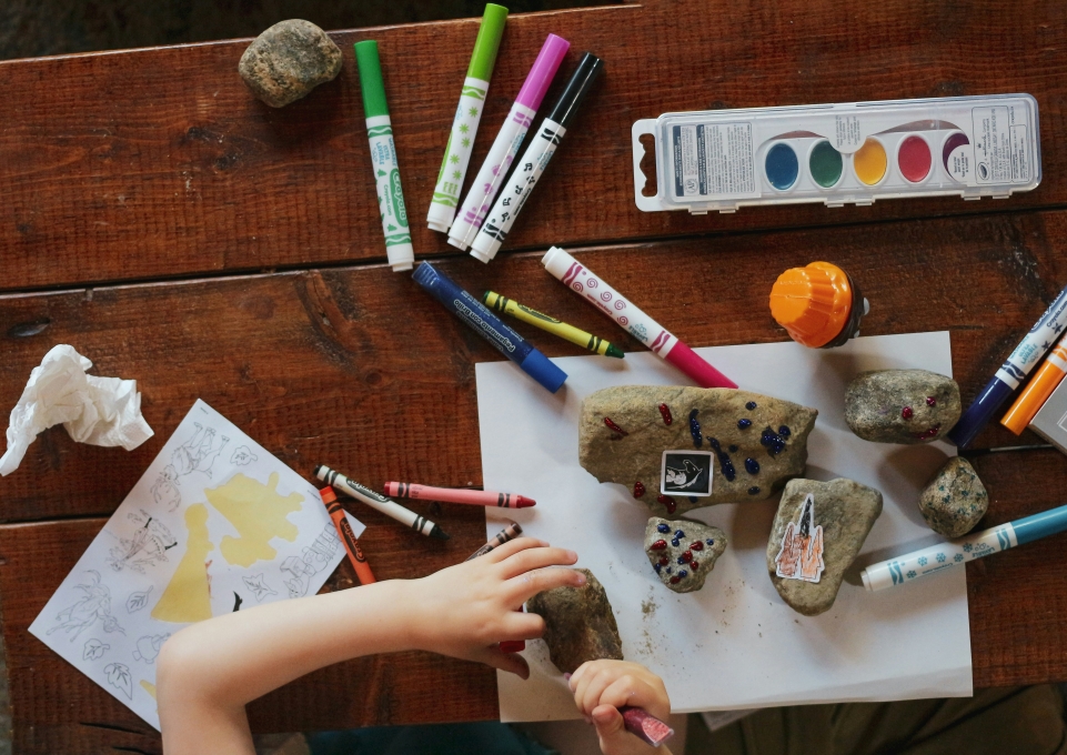 Child working on art project with Crayola products